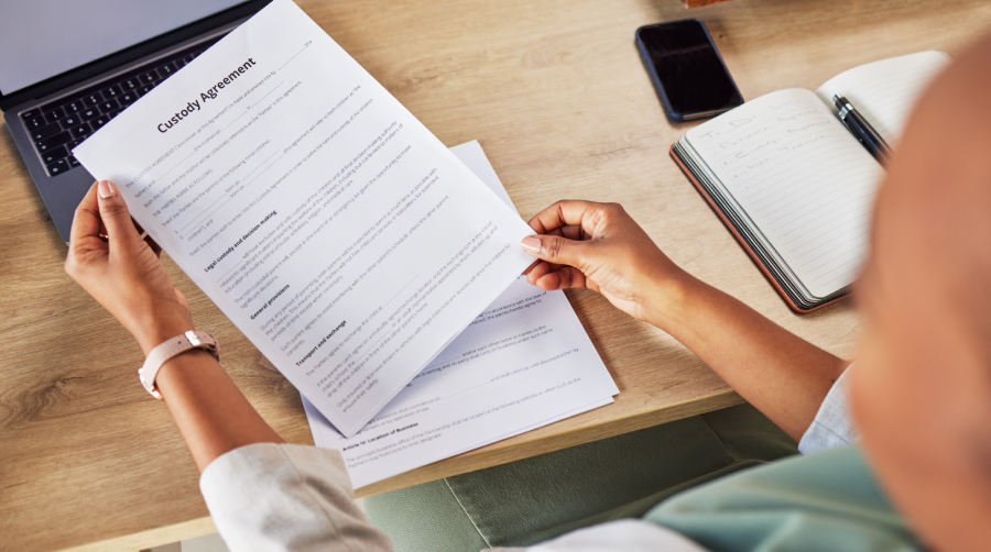 Family lawyer, hands and custody contract with attorney case and notes with agreement in a office