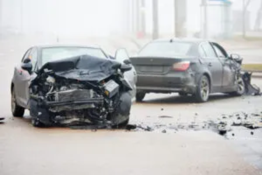Car crash accident on street with wreck and damaged automobiles after collision
