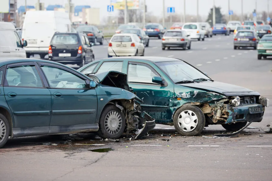 car crash accident on street, damaged automobiles after collision in city