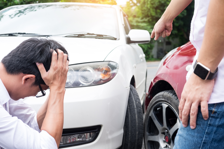 Two men arguing after a car accident Traffic Collision on the road