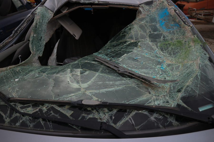 A broken car windshield, at a car graveyard, in Kozani, Greece