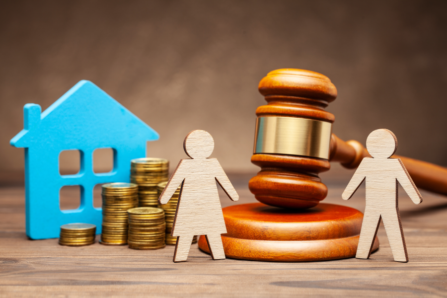 A woman with a house and money, and a man with a hammer of a judge.