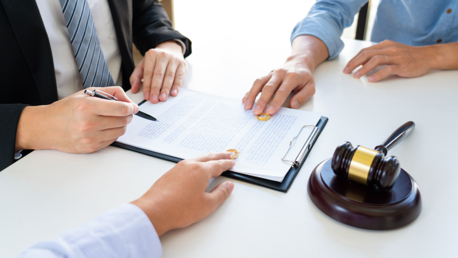 Couple husband and wife during divorce process listening to lawyer dissolves marriage contract,