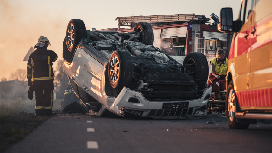 Daytime Crash Scene with Damaged Car.