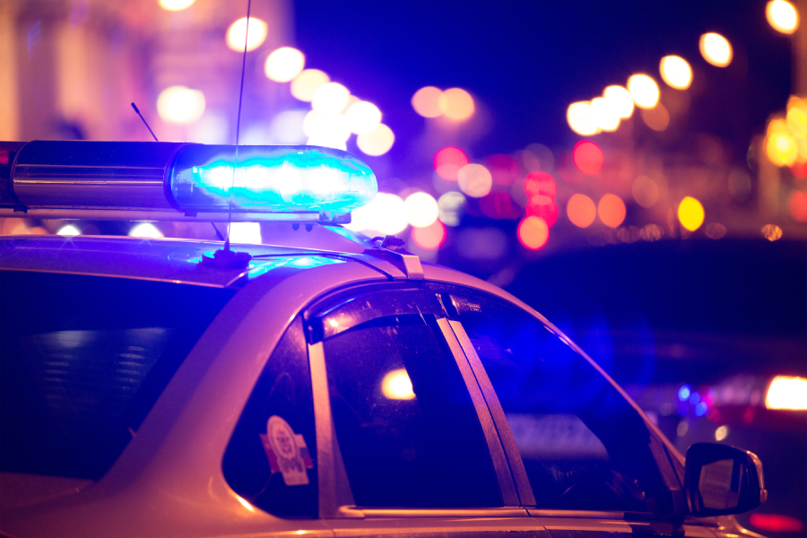 Blue light flasher atop of a police car.