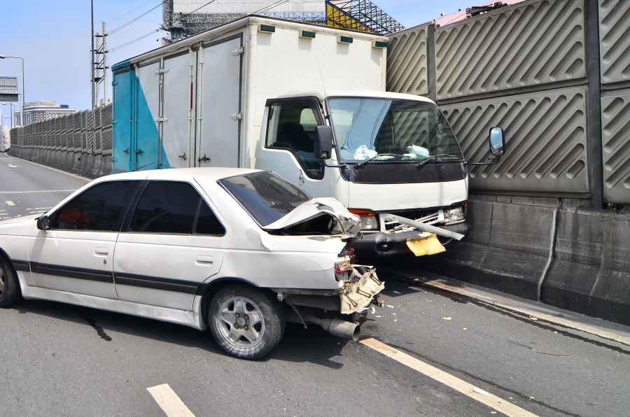 Two cars crash on the road